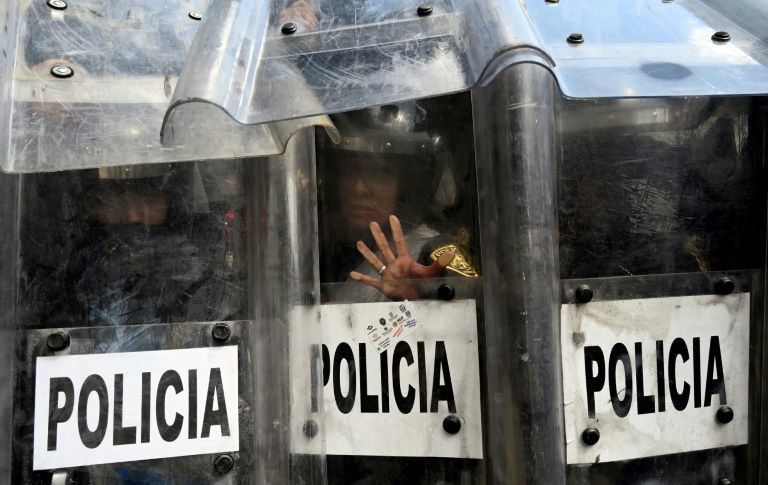 Protestors-clash-with-shielded-Mexican-officers