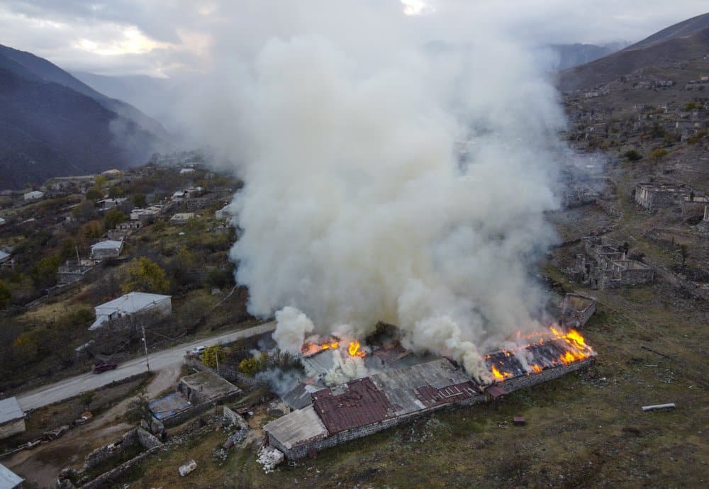 Armenians torch their homes and belongings on land surrender to Azerbaijan