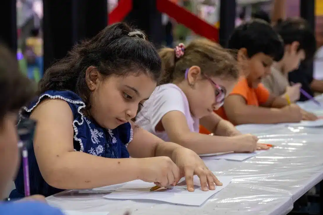 Children participating in an art workshop at Sharjah children reading festival 2024