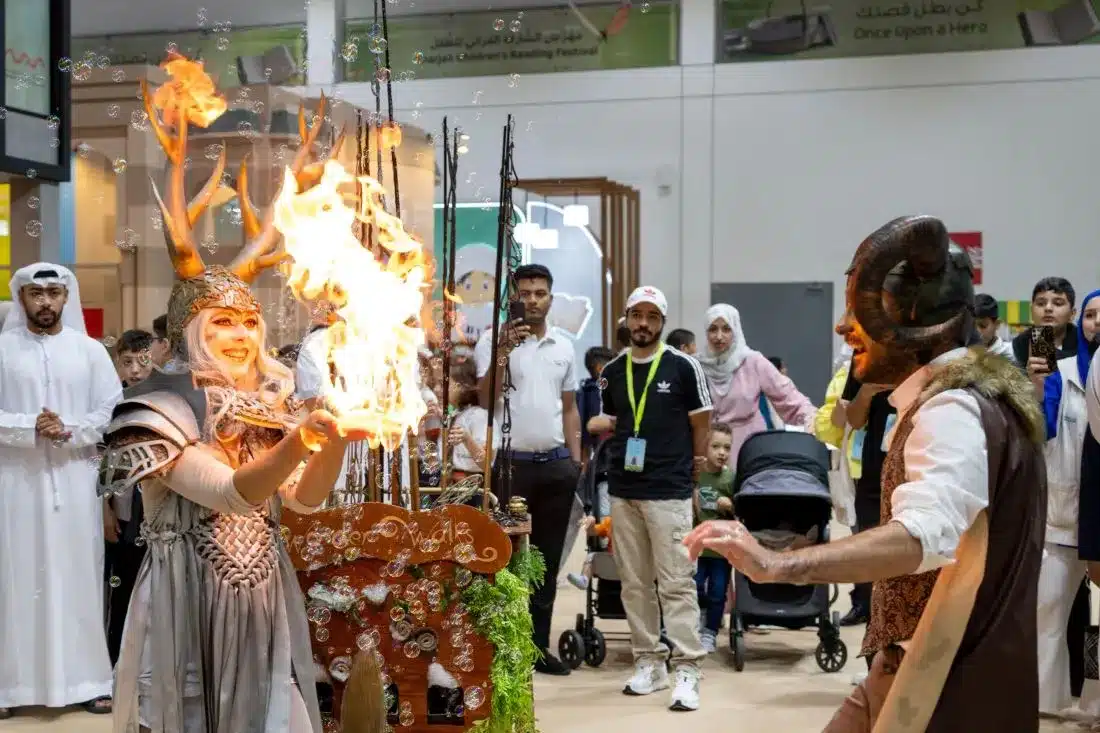 Lady artist displaying fire show at Sharjah Children reading Festival