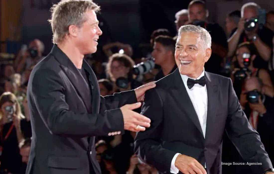Brad Pitt George Clooney dance hug after Wolfs’ standing ovation