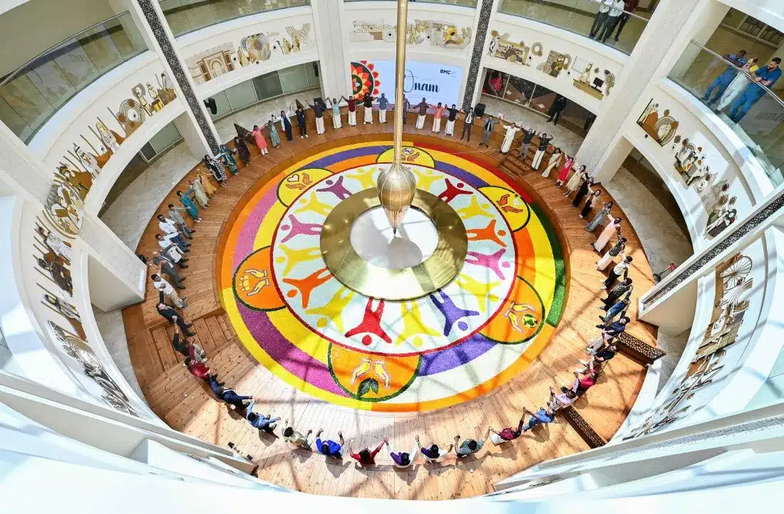 Over 100 healthcare workers made a giant pookalam in Abu Dhabi as a unique floral tribute for onam honoring UAE’s Spirit of generosity