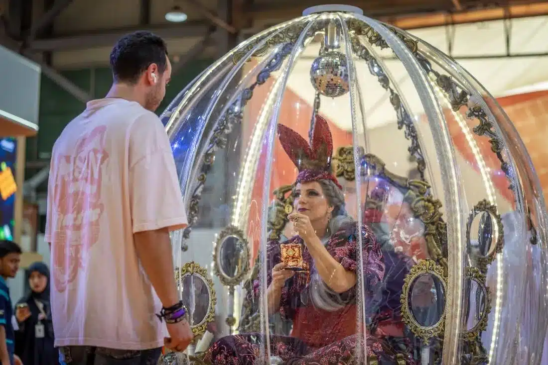 The lady in the mystic globe enchants spectators at the 43rd Sharjah International Book Fair