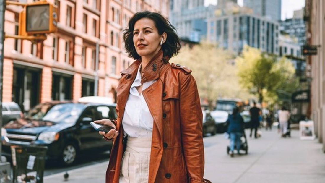 A middle age women walking on the road